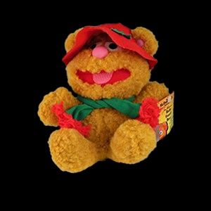 Baby Fozzie Bear is a 8" plush bear wearing a hat